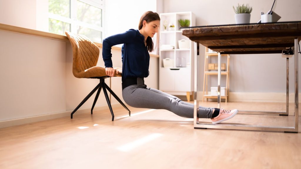 Woman doing exercise at the office