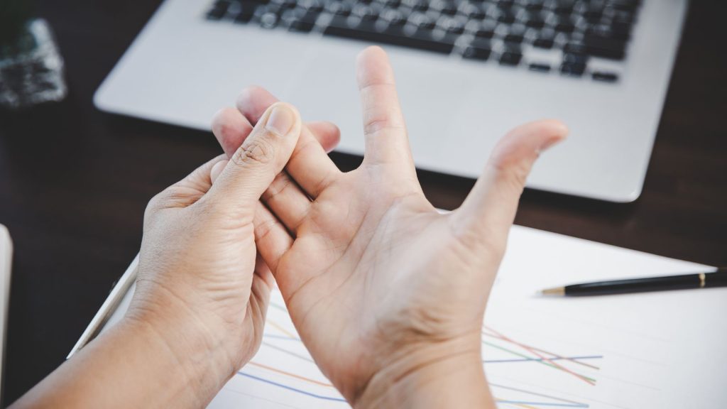 Woman stretching and touching her fingers