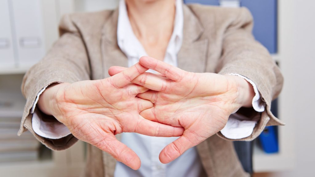 Woman stretching and twisting her palms