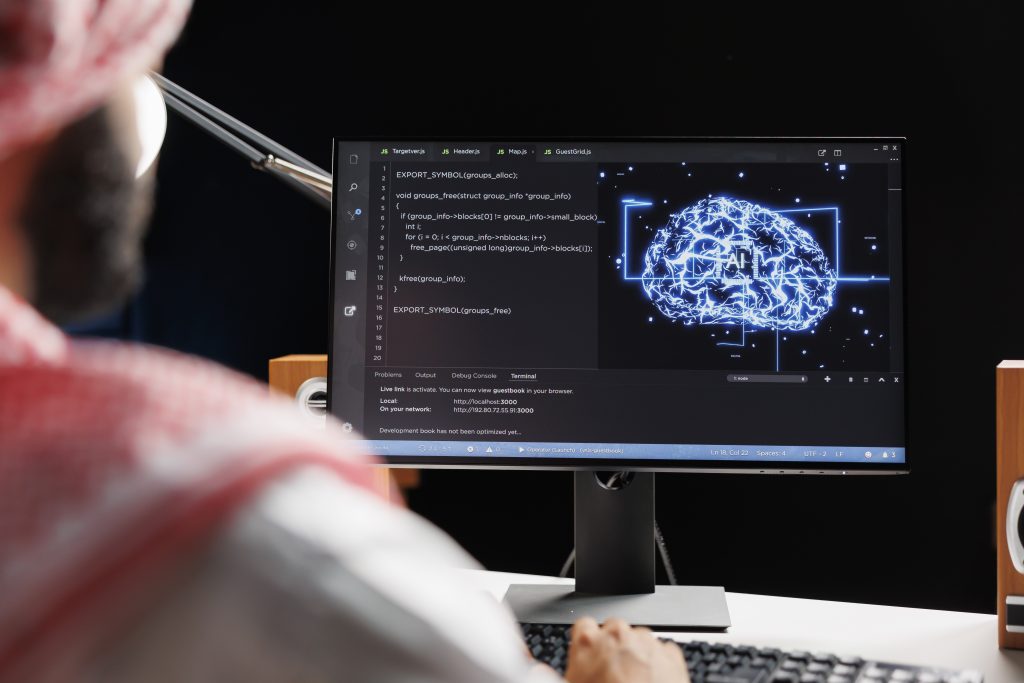 Detailed image of an Arab man using AI and machine learning, ensuring cybersecurity and developing software for computing. monitoring a network of interconnected systems. Close-up shot.