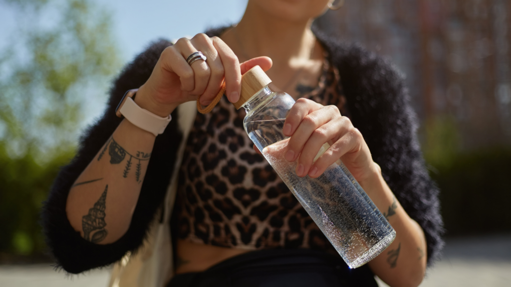 woman holding a reusable water bottle