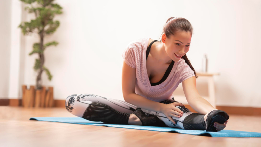 a woman doing yoga or stretching at home