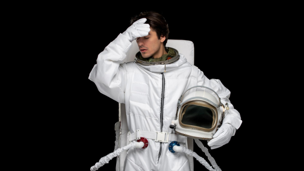 astronaut with helmet off experiencing motion sickness