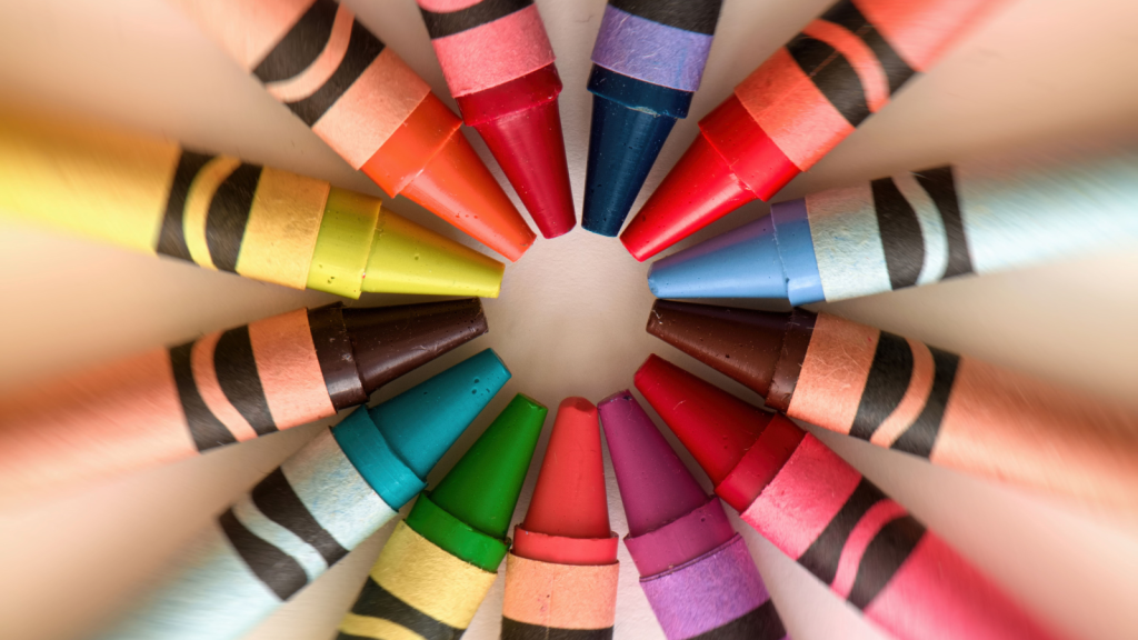 Crayons color pencils circular abstract background and art