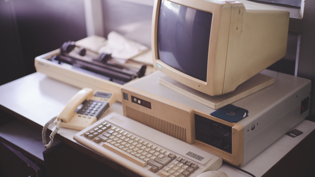 Old office and computer with obsolete technology