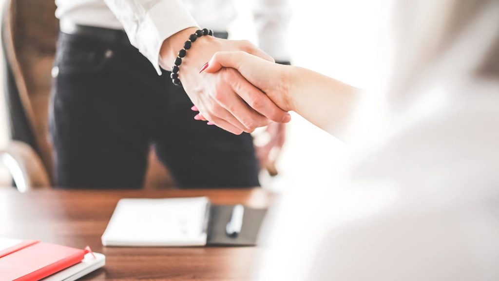 man and woman handshake