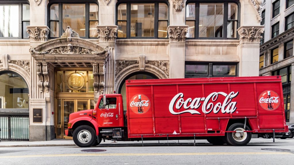 a coca cola lorry on a street