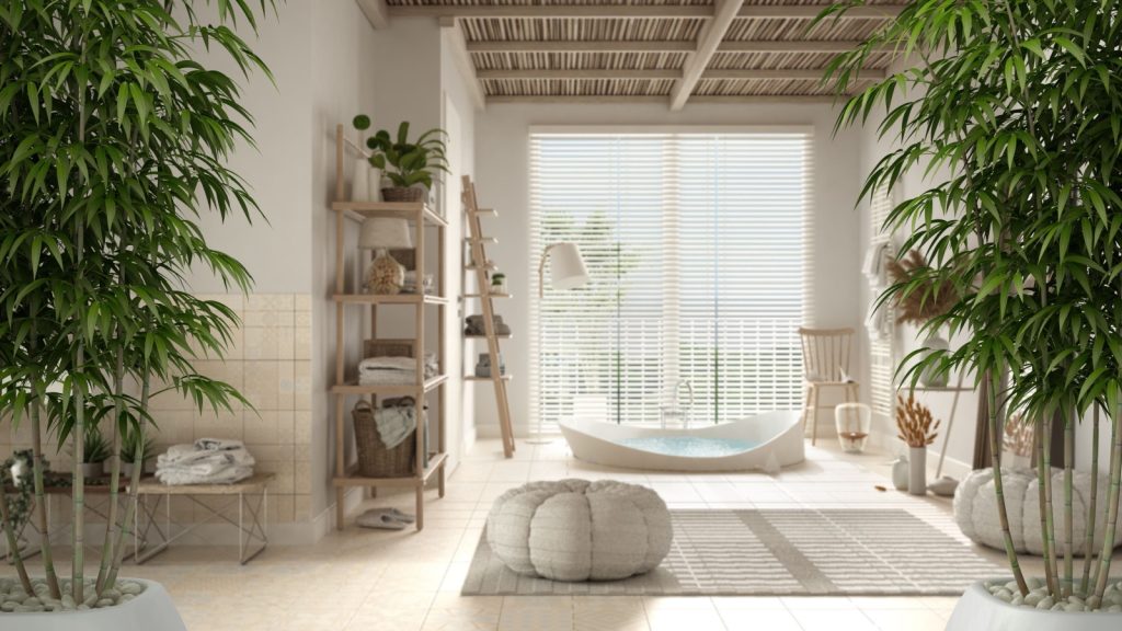 bathroom with potted bamboo plant, natural light, big bathtub, ceramic tiles floor, carpet, round poufs and shelf