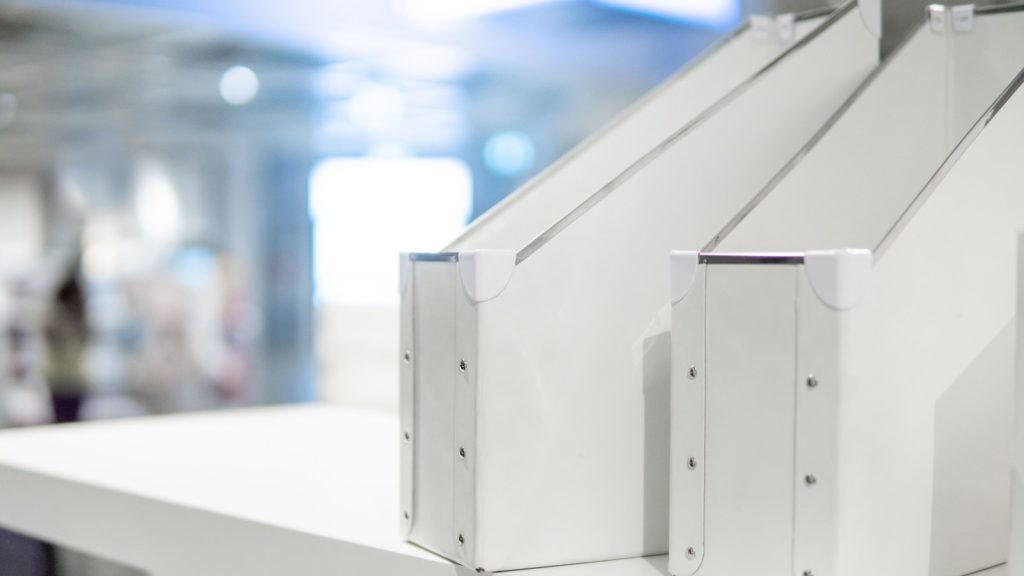 Empty white file holder on shelf for business document or magazine.