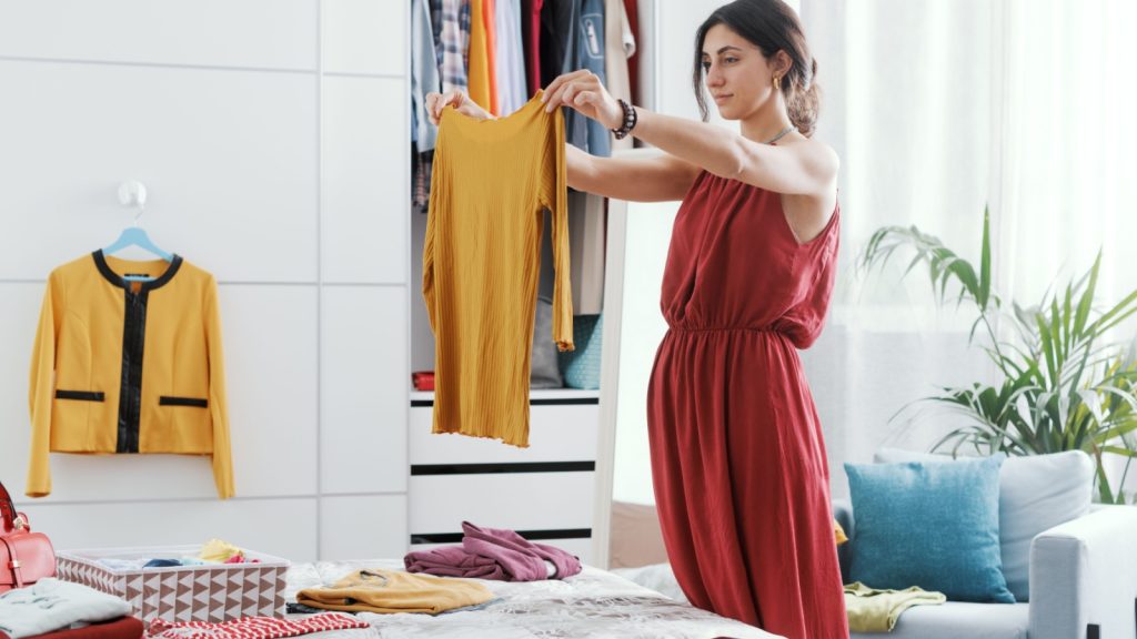 woman decluttering her wardrobe