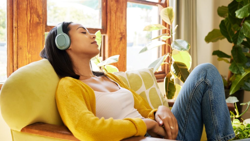 a young woman listening to music with headphones