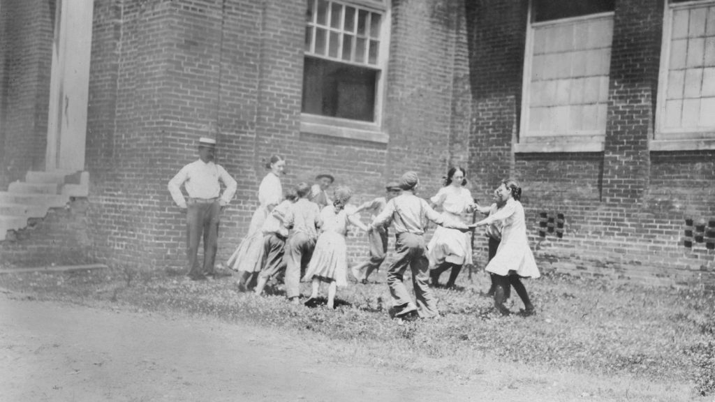 Children playing ring around the rosy