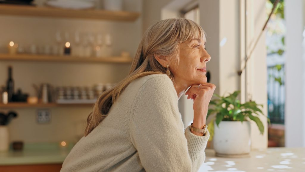 happy elderly woman with thinking