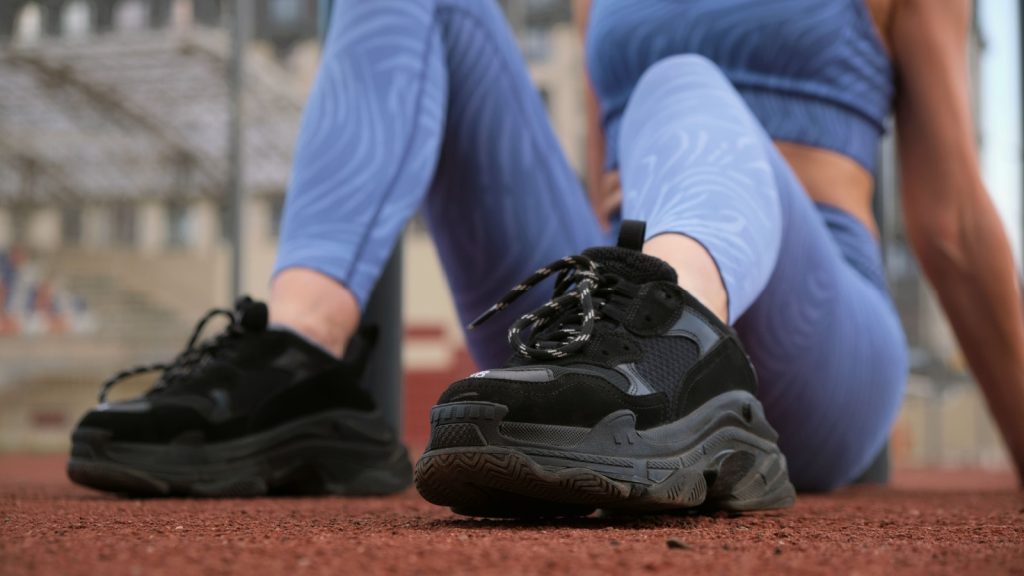 Close-up of a woman's black sneakers 