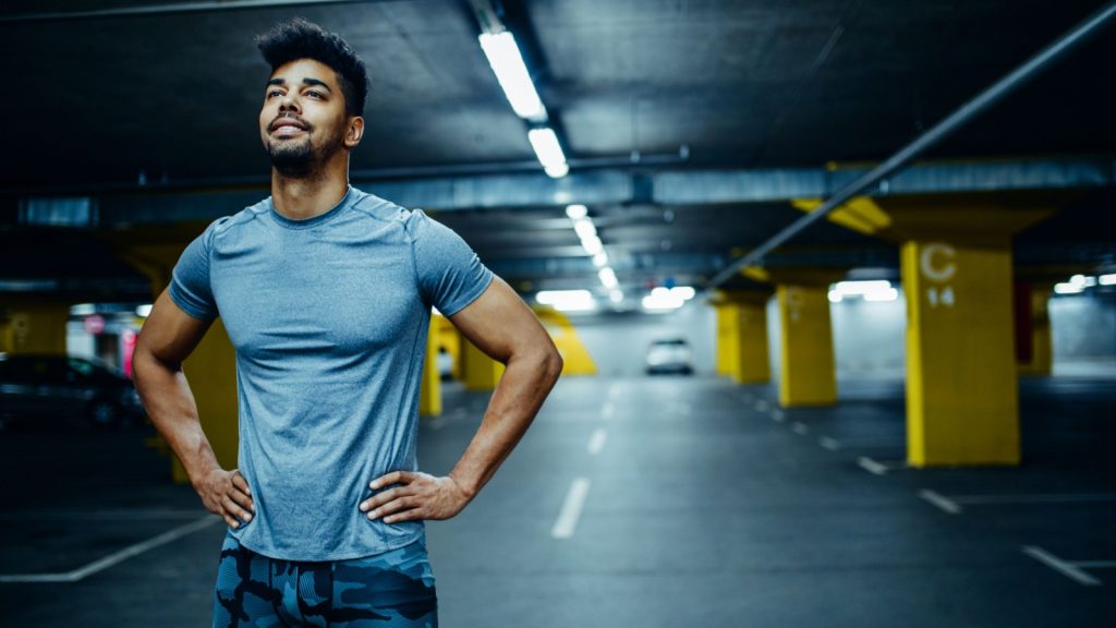 Portrait of a man holding his hands on his hips