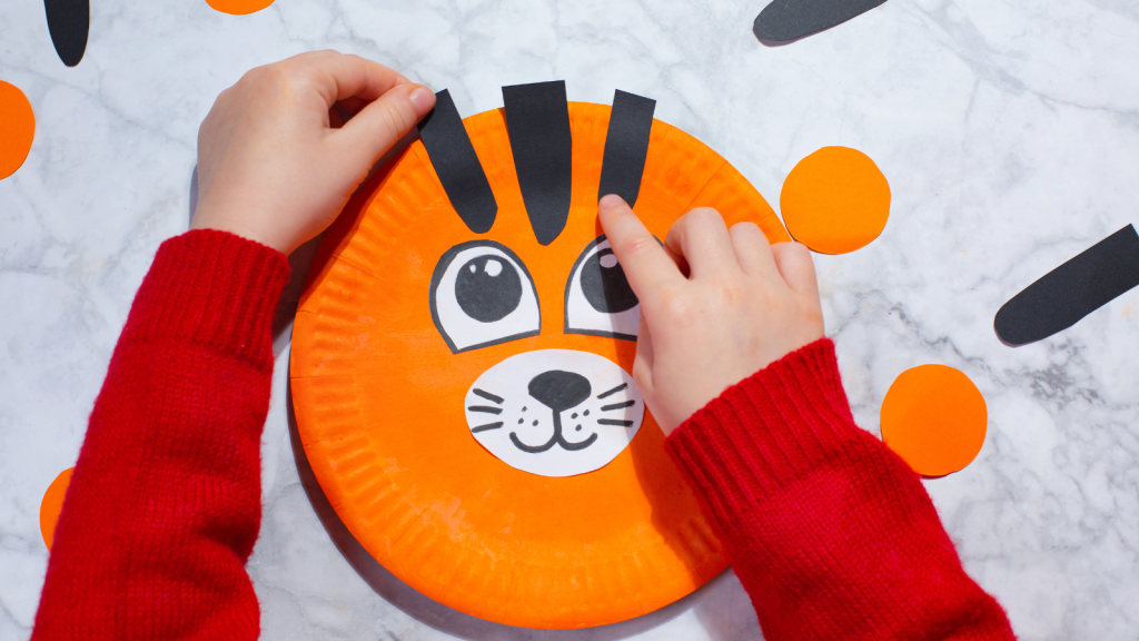 Tiger made of paper plate tiger craft step glue black stripes