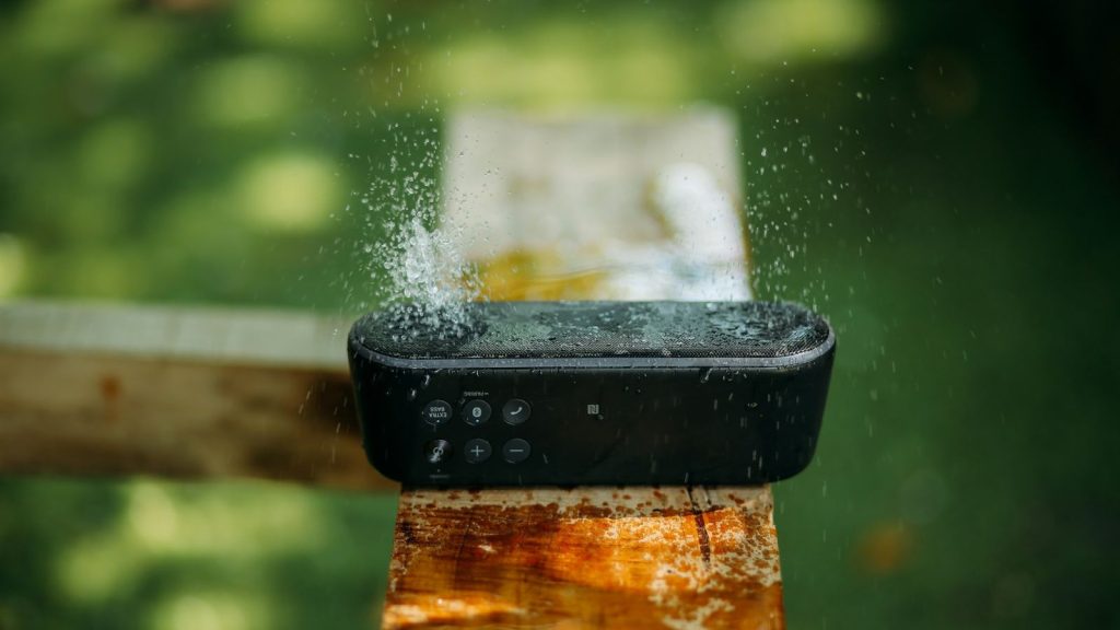 water splashes on waterproof bluetooth speaker