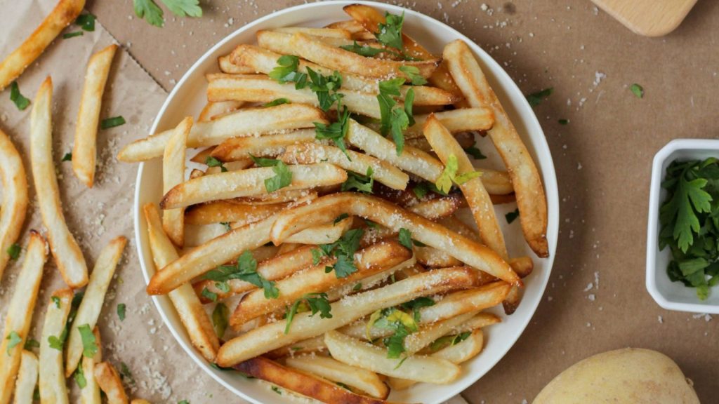 a plate of french fries or chips in UK