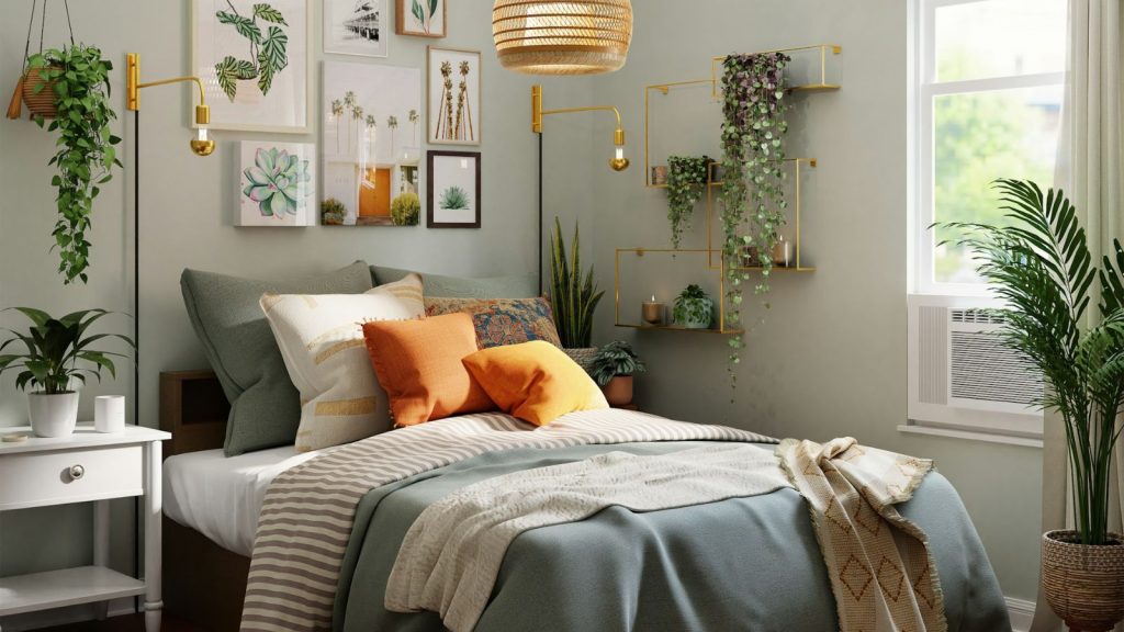 natural light shining through the bedroom with wall frames, hanging plants, and throw blanket