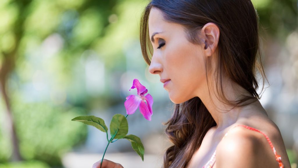 woman smelling the flowers