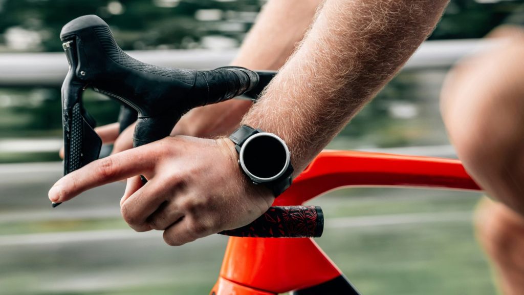 man cycling with watch