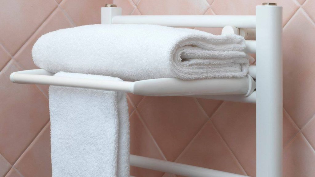 2 white towels on a towel rail