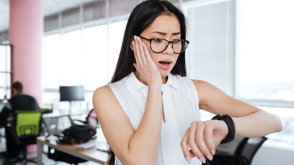 stress woman looking at watch