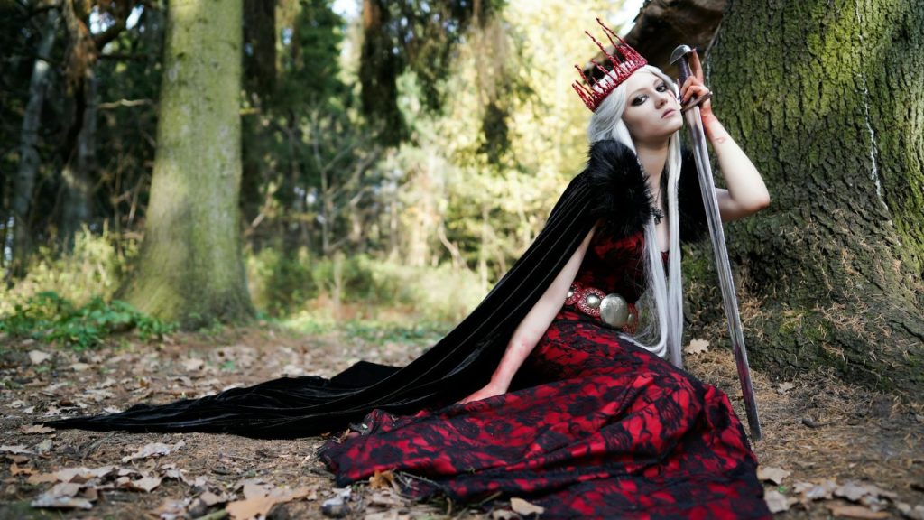 woman wearing a queen costume with sword