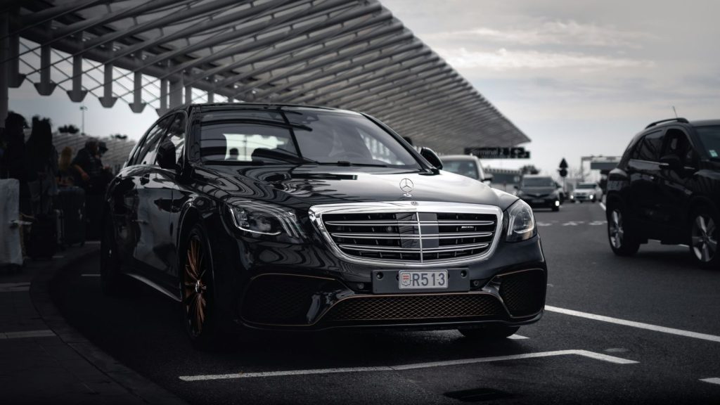 Black luxury car parked outdoors