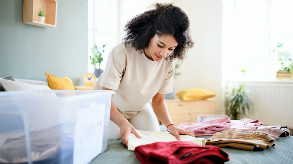 a woman decluttering her wardrobe