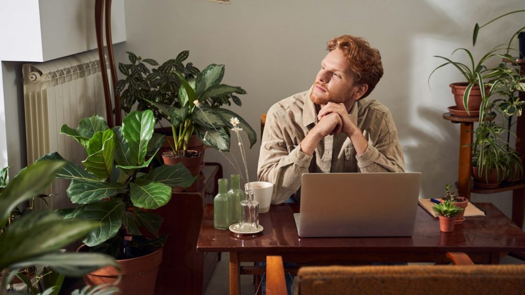 man inside his office thinking or reflecting