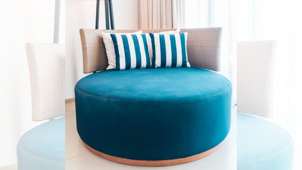 blue round chair with blue and white stripes pillows