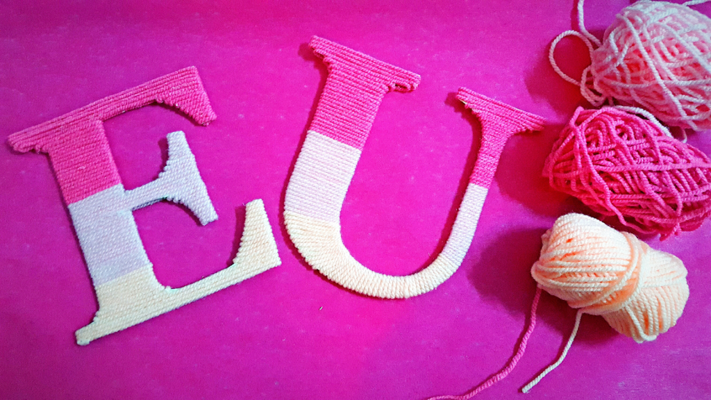 Pink yarn wrapped letters