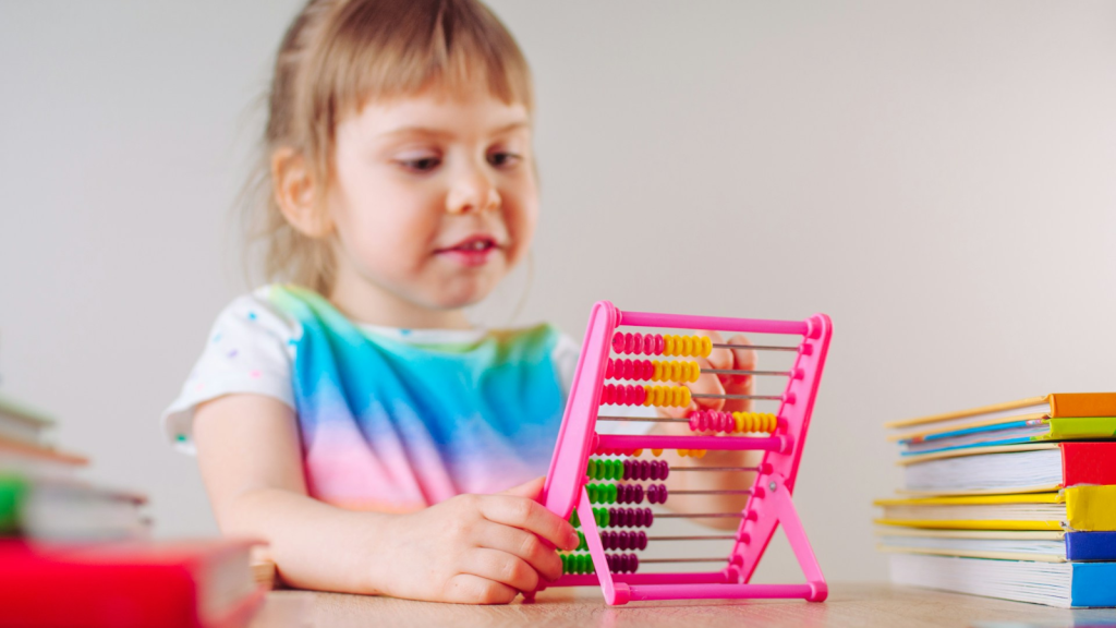 little girl playing abacus